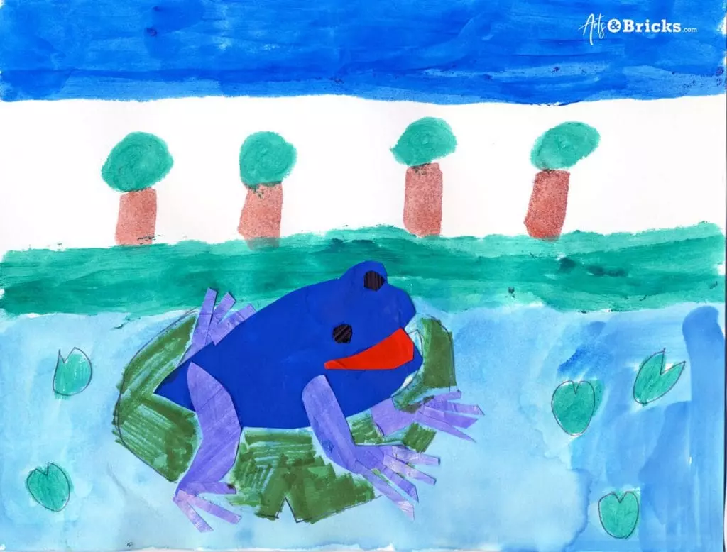 This kid-friendly collage art project features a watercolor background and a cut-paper frog in the foreground.