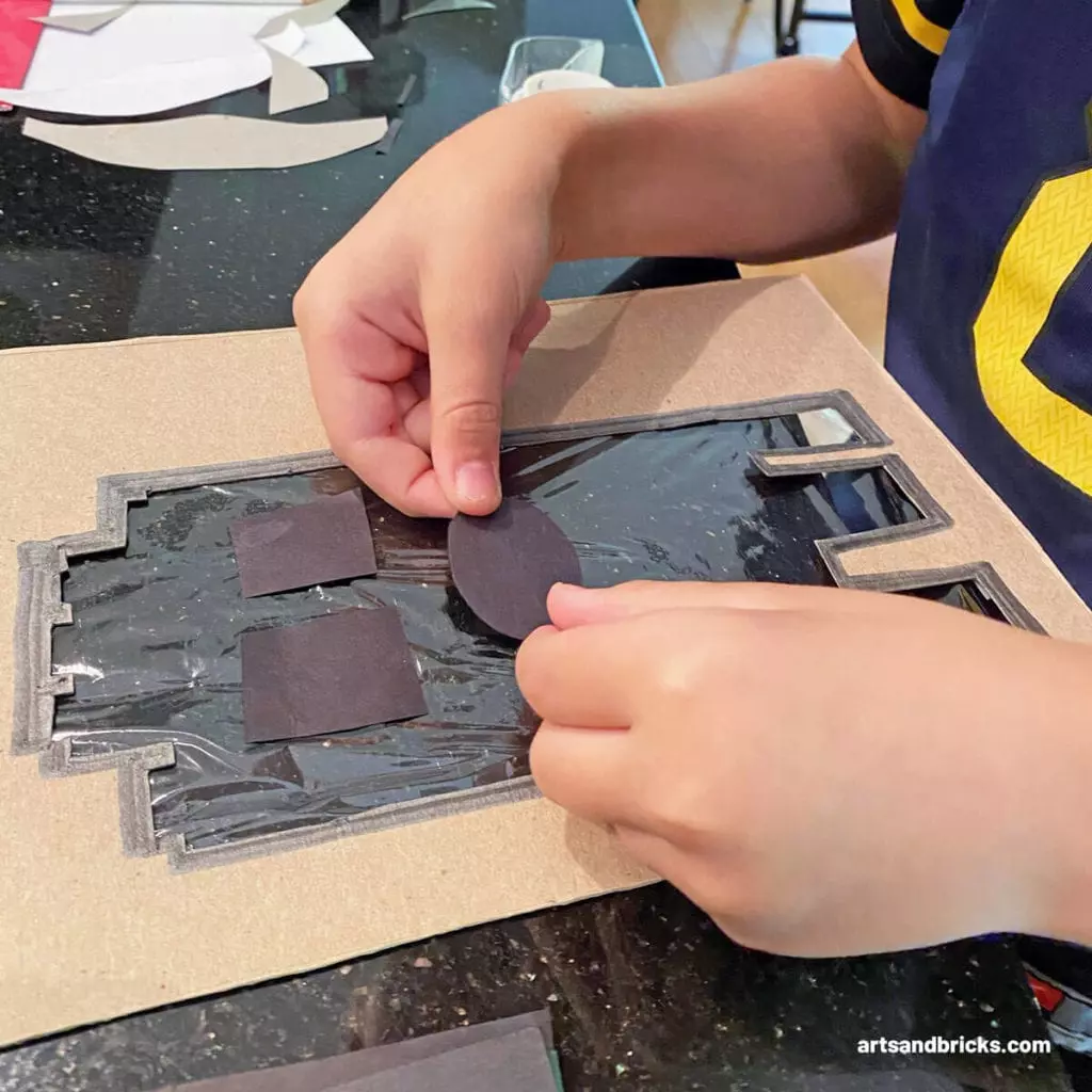 Explore your surroundings with this Ghost Peek-A-Boo Cardboard Craft! Use cardboard (we used a cereal box panel) to create a ghost. Ours is a LEGO brick ghost!!! Add plastic wrap over the body and tape on a spooky face. Don't forget to add a BOO! Next is the fun part, start framing textures and colors - both indoors and outdoors. Don't forget to take pictures! Have fun!#lego #craft #google #cardboard #forkids #easy #recycled #naturecrafts