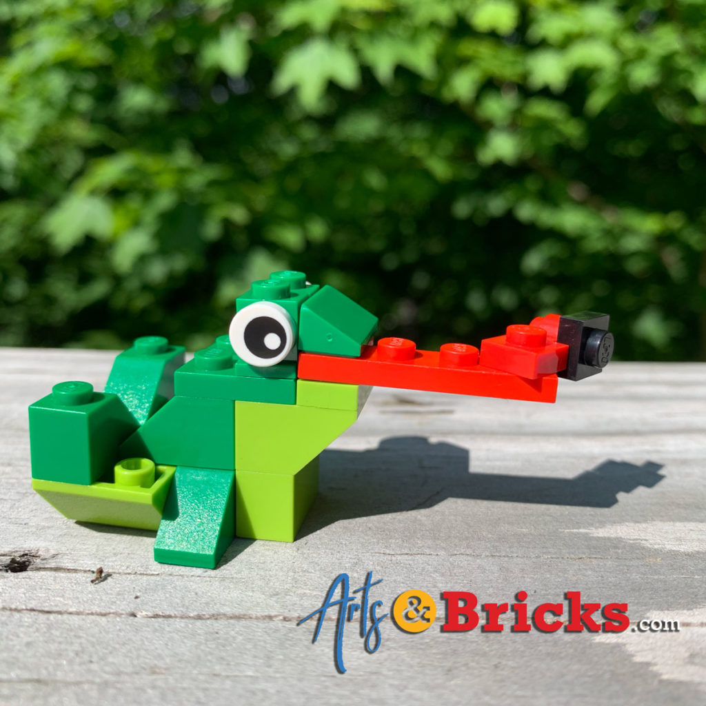 You can download the frog pattern shown above or learn more about it on Lego.com

We built the suggested frog and then started experimenting. Frogs have long tongues and eat flies, right? Modify! Different pieces for the back jumping legs? Yep! Multi-color? Check.