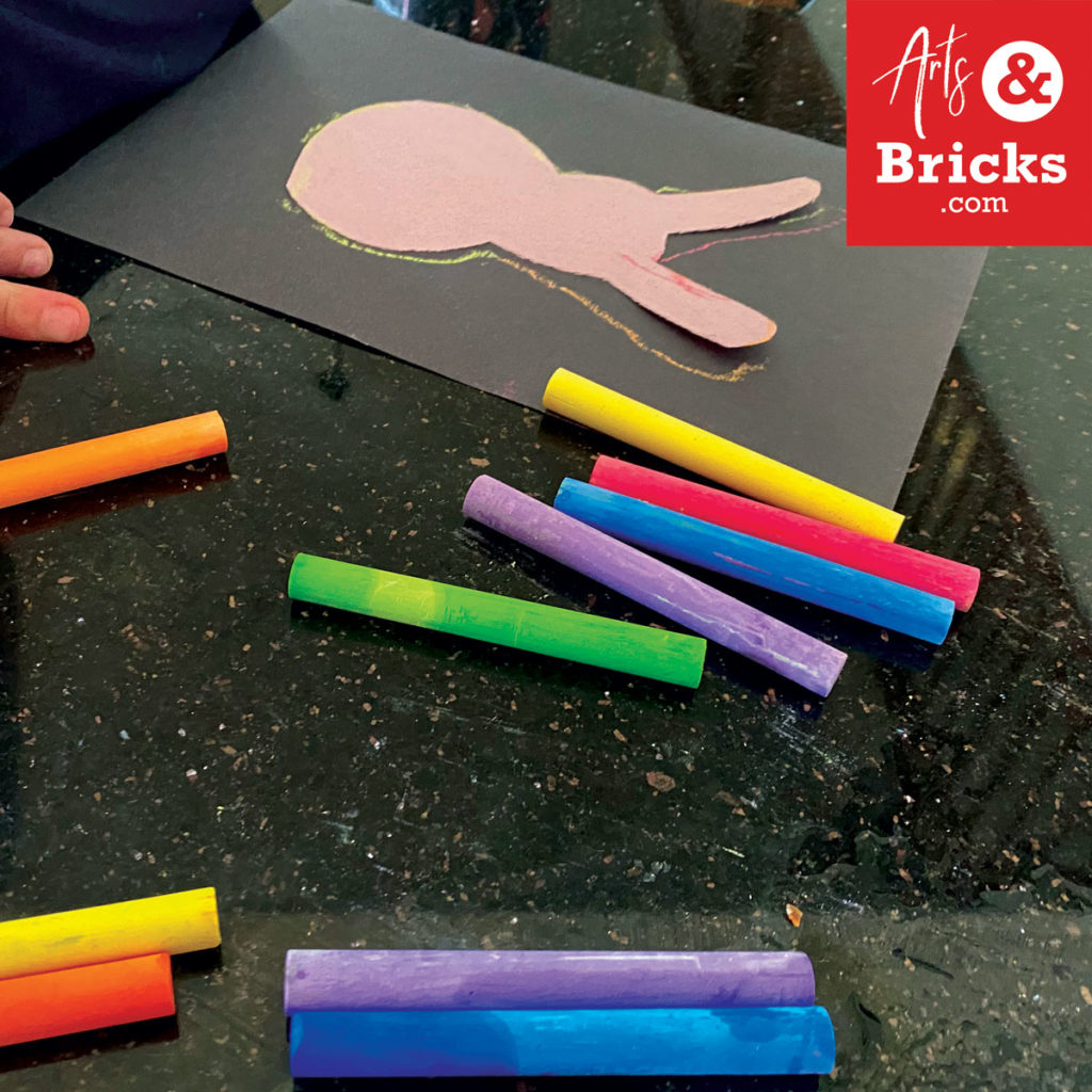 use chalk, chalkboard chalk, to decorate a bunny on construction paper
