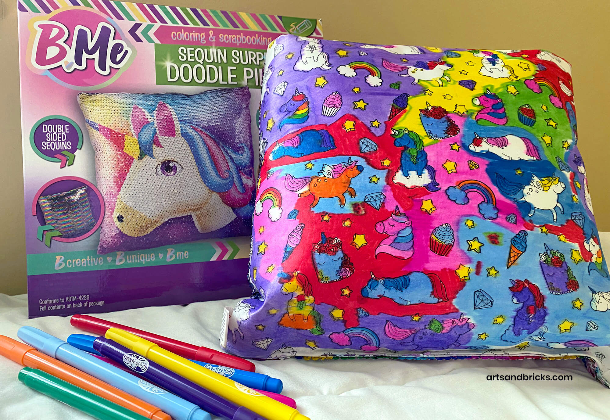 BMe Sequin Surprise Doodle Pillow with bright-colored fabric markers