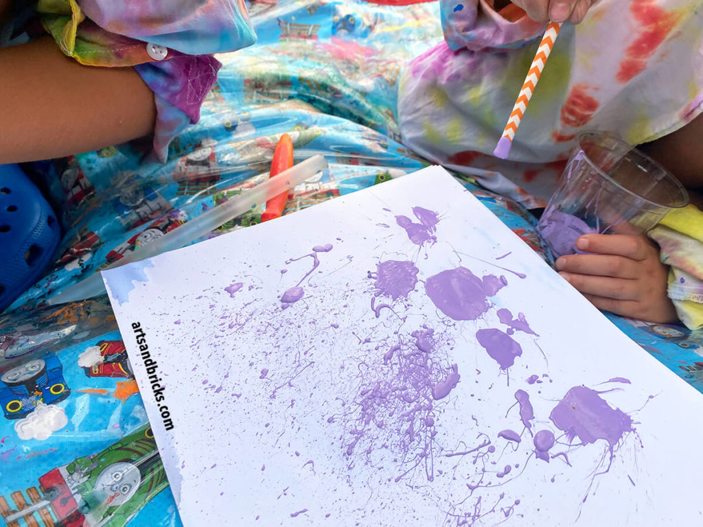 Painting with acrylic paint and straws. Use the straws to flick paint, splatter paint and blow paint around on the page.