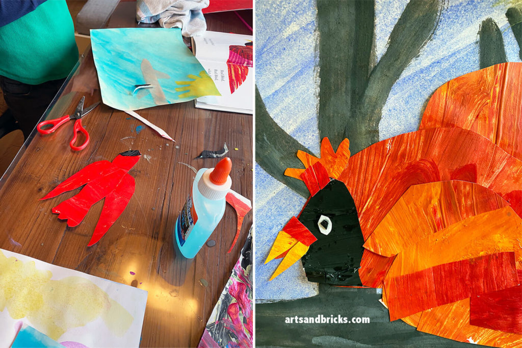 Cardinal made from cut pieces of red, orange, yellow, and black-hued painted paper.