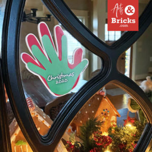 Holiday family handprint printed on window vinyl displayed in your home as holiday decor