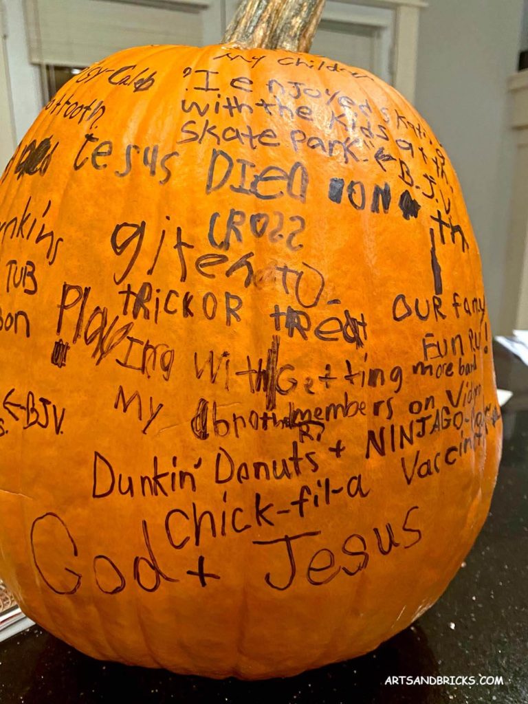 A gratitude or thankful pumpkin. Kid-written joys and gratitudes written in Sharpie markers.