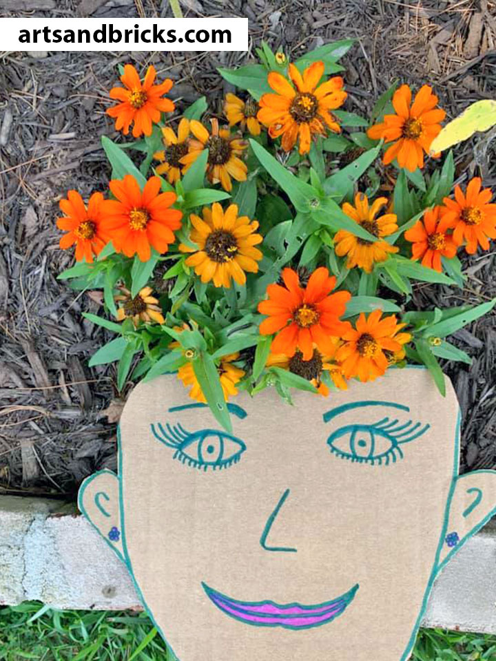 Soak up your last days of summer sunshine outside with your little ones making and photographing this adorable nature craft! Bonus! You'll have as much fun (and maybe even MORE fun) than your child with this one. Just cardboard, scissors, paints/markers or crayons and a camera required!