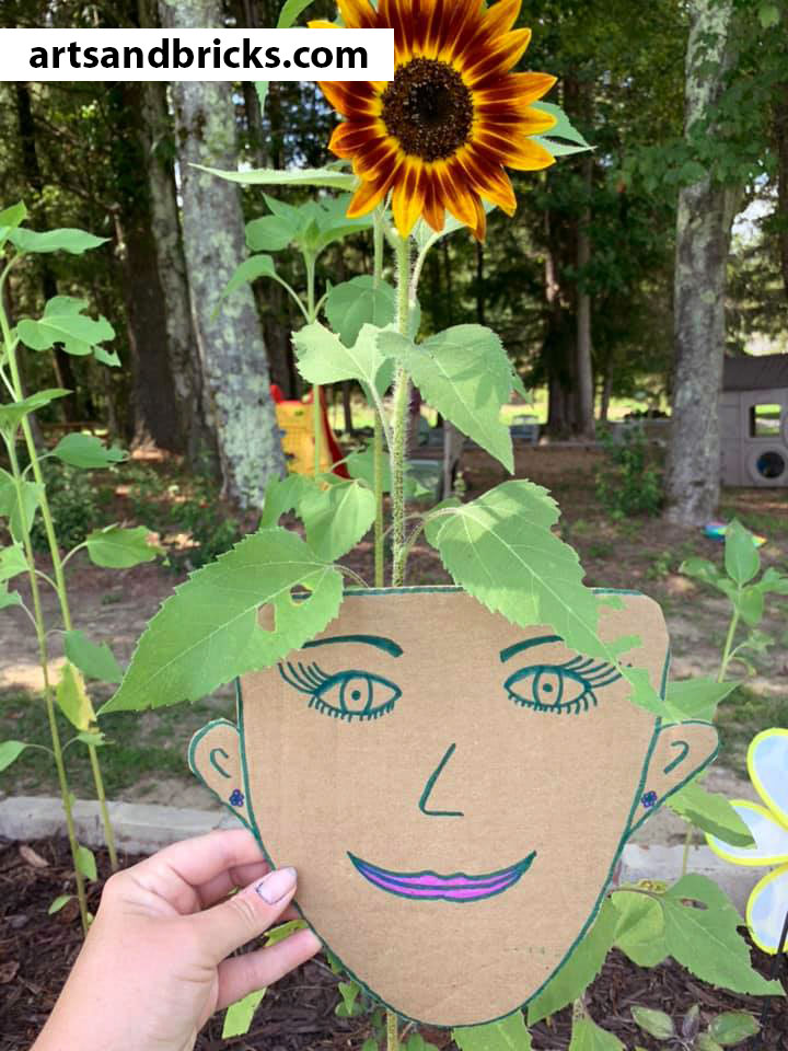 Soak up your last days of summer sunshine outside with your little ones making and photographing this adorable nature craft! Bonus! You'll have as much fun (and maybe even MORE fun) than your child with this one. Just cardboard, scissors, paints/markers or crayons and a camera required!