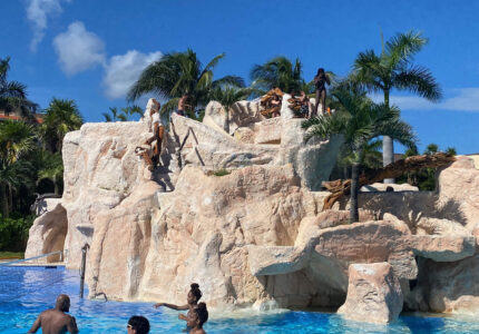 The best pool at El Cid, the Marina pool with water slide and jumping rock; water volleyball and more.