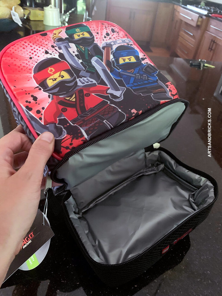 Back to school LEGO style - This was our 2nd-grade boy's lunch box choice for the current school year. Featuring three Ninjago ninjas, Kai (Fire Ninja), Lloyd Garmadon, and Jay (Lightning Ninja), this one is sure to delight any Ninjago fan in your life. Available from Amazon Prime.