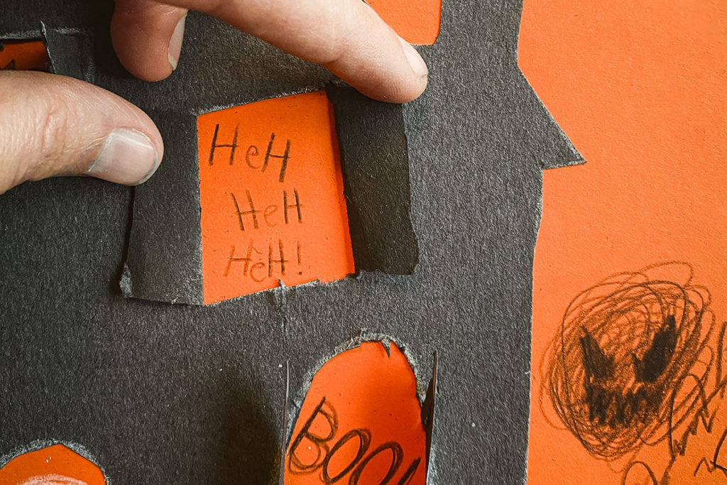 Make a paper haunted house with windows and doors that flip open