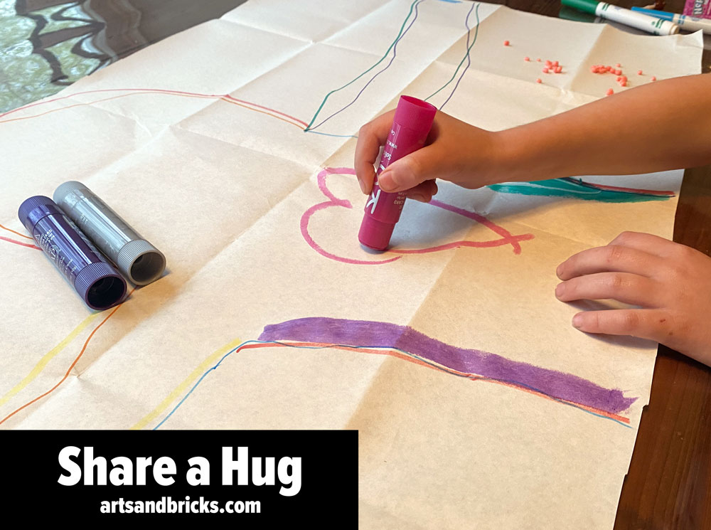 Learn how to make, mail, and share a paper hug from your child! This fun and simple kids craft activity spreads joy to everyone! Get inspired and check out instructions on our blog post. #kidsart #mailahug #gifts #diycraft