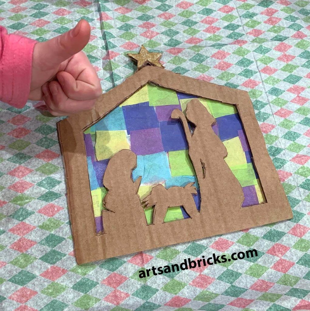 This year, I asked my 4th-grade son to make a gift for his teacher to accompany our gift card and note. He decided to make this Mosaic Nativity Hanging Ornament. Learn how to make it for your family too.
