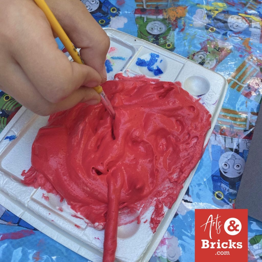 This is red puffy paint created with Barbasol Original Shaving Cream, Elmers Glue and acrylic red paint. #puffypaint #artproject #4thofjuly #fireworks