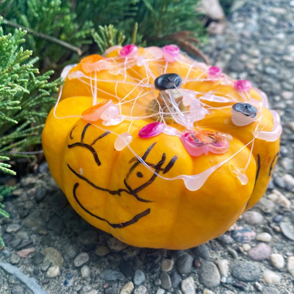 A no mess-way to decorate your pumpkin is to color it with Sharpie markers. While you're at it, you can use hot glue to make spiderwebs! 