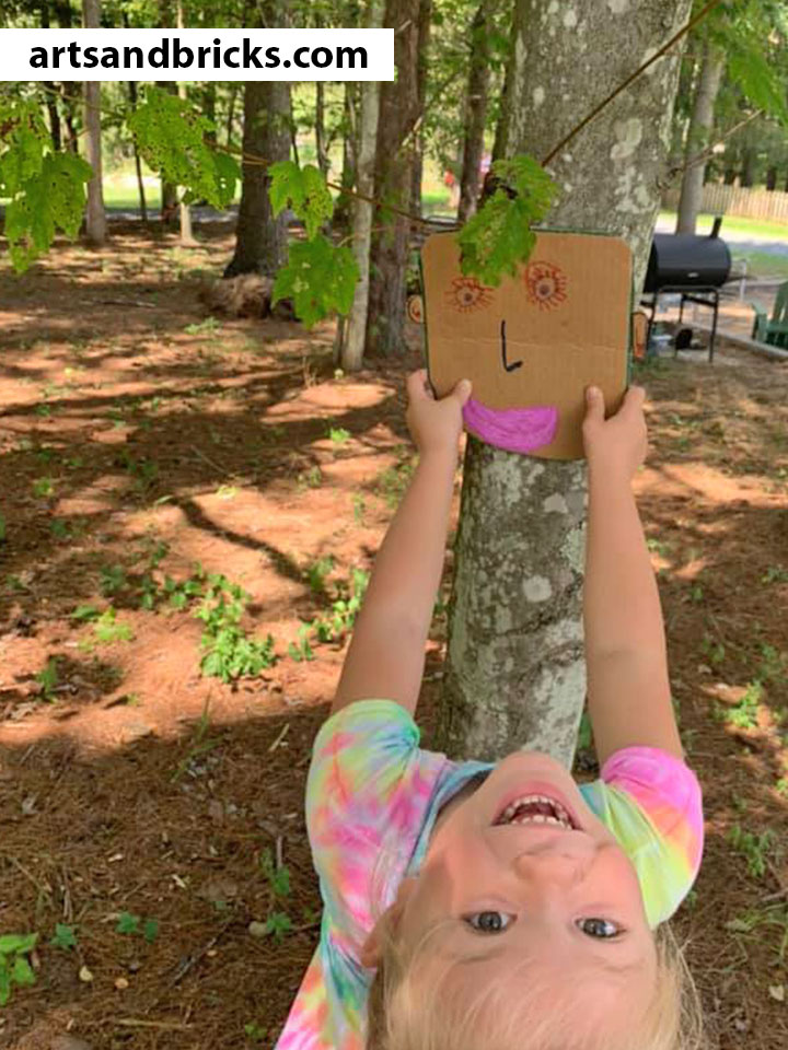 Soak up your last days of summer sunshine outside with your little ones making and photographing this adorable nature craft! Bonus! You'll have as much fun (and maybe even MORE fun) than your child with this one. Just cardboard, scissors, paints/markers or crayons and a camera required!