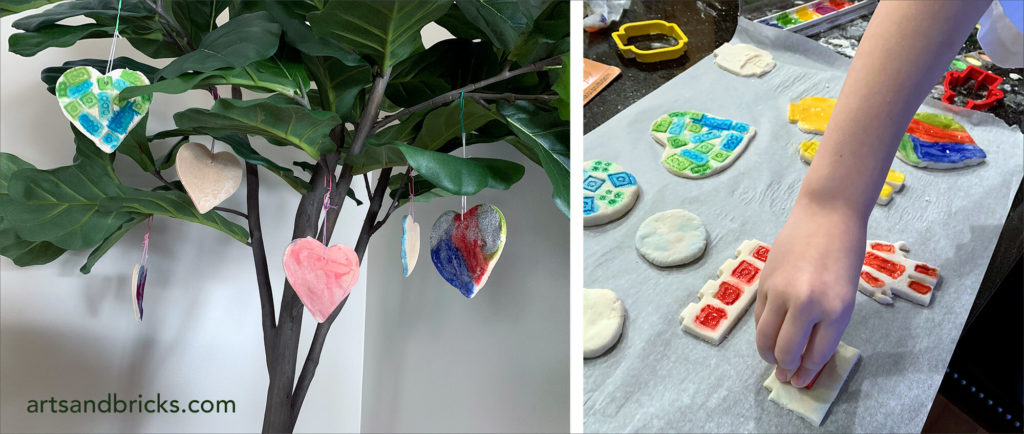 Salt dough ornaments for kids. Painted with watercolor. Sprinkled with glitter. used LEGO bricks and cookie cutters to make shapes and designs in the ornaments.