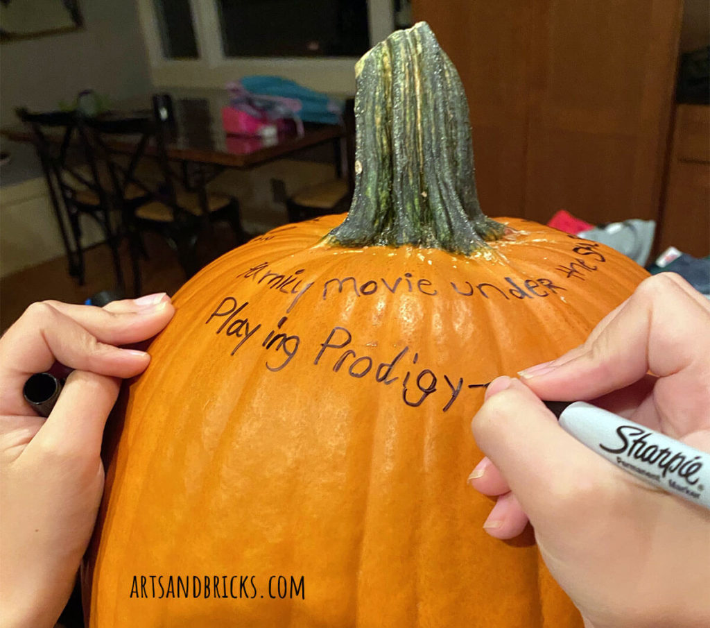 Writing joys on a gratitude pumpkin