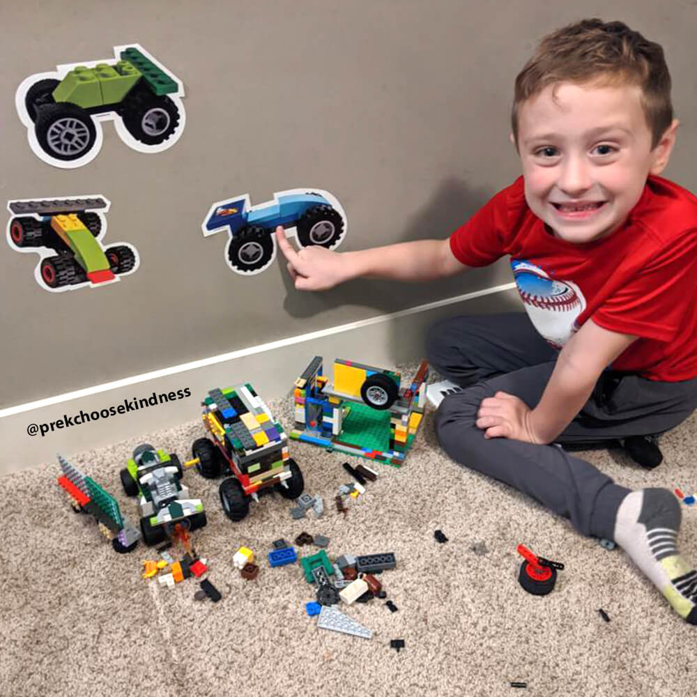 Young boy enjoying his LEGO-Brick Built Race Car wall decals by Arts and Bricks.